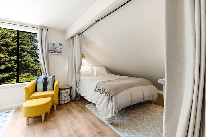 A Queen sleeping niche on one side of the main room. Equipped with room darkening curtains for a cozy sleep  