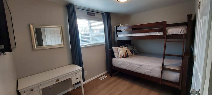 Bunk room with Double bottom and twin top bunk, with desk work area