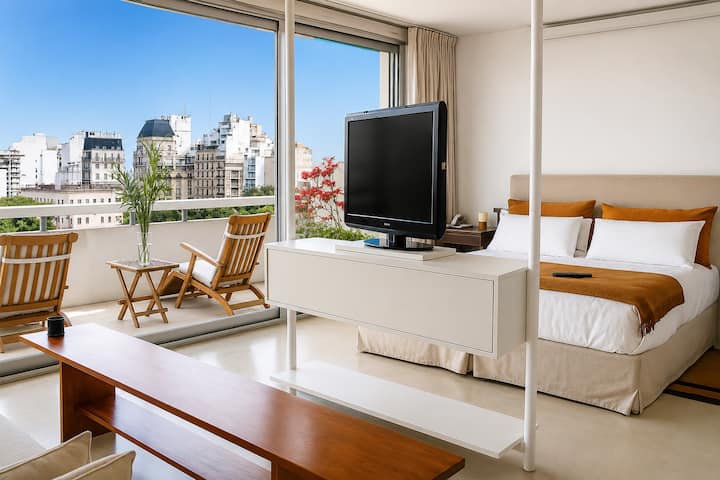 King suite with hot tub and park-facing balcony