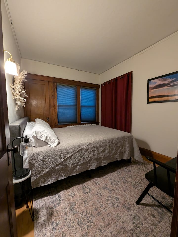 First floor Queen Suite with seasonal Private Cure Porch behind the curtains 