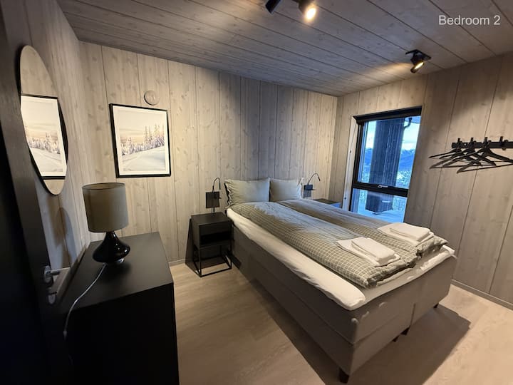 Bedroom 2, 150cm bed (ground floor).
Bedside lights with integrated mobileholder and charger (USB-A)