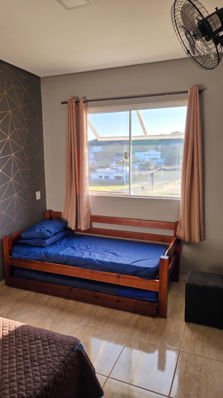 Bedroom on the left, with double bed and double bed, sleeps 4 people.