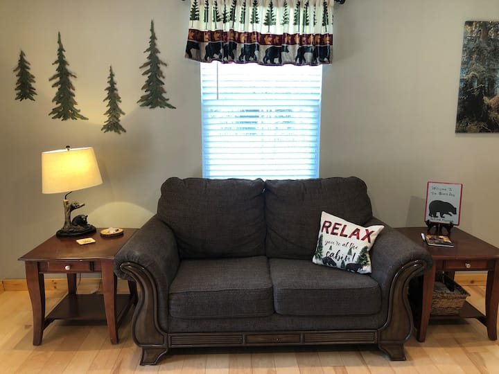 Love seat, end tables, and local brochures and information