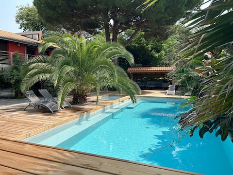 The red house, swimming pool, 2 minute walk to the beach.