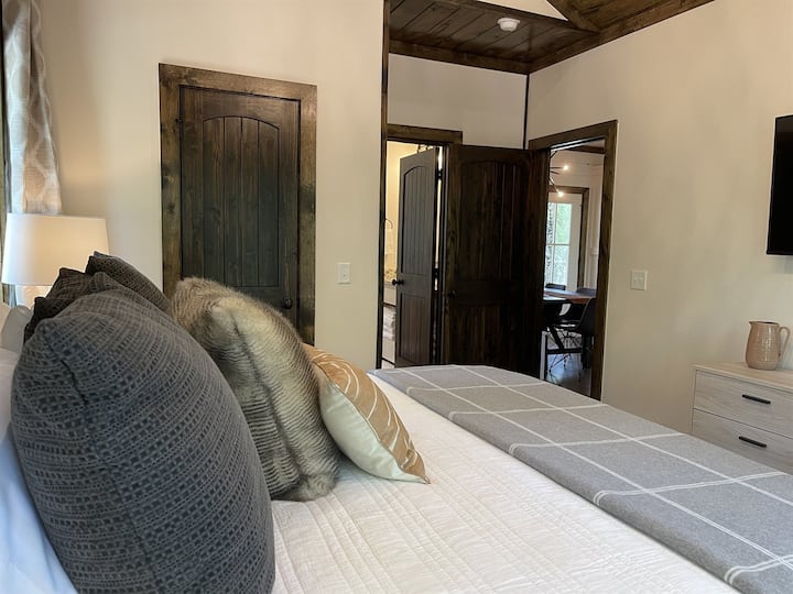 Main bedroom looking towards bathroom and dining area.