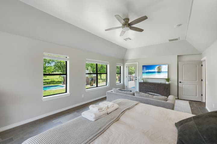 King TEMPUR-PEDIC® with adjustable base.  Master Suite: Bright and airy sanctuary with serene views and plush seating for relaxation!