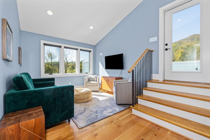 Upstairs living area with sleeper sofa & smart TV