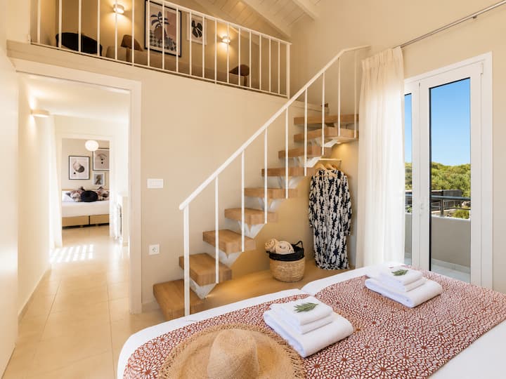 Villa 1 - First Floor - Bedroom 1 - Two single beds that can be arranged as a king-size bed, plus an attic level with an additional single bed and a private balcony