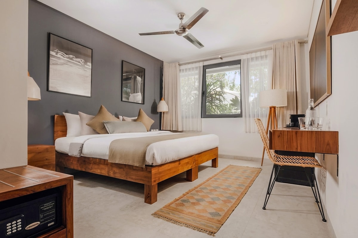 Bright bedroom suite with king bed at Address Bali Villa