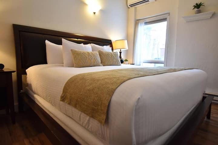 King bed and window facing the woodlands