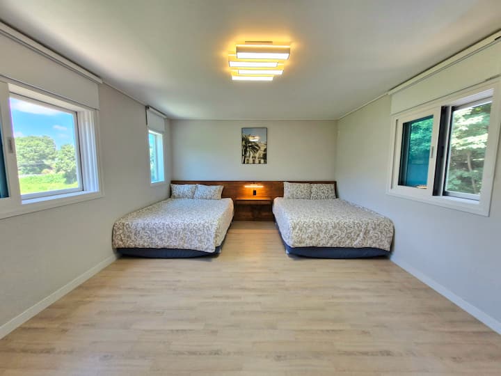 (Bedroom 1) This is a large room with two queen-sized beds.