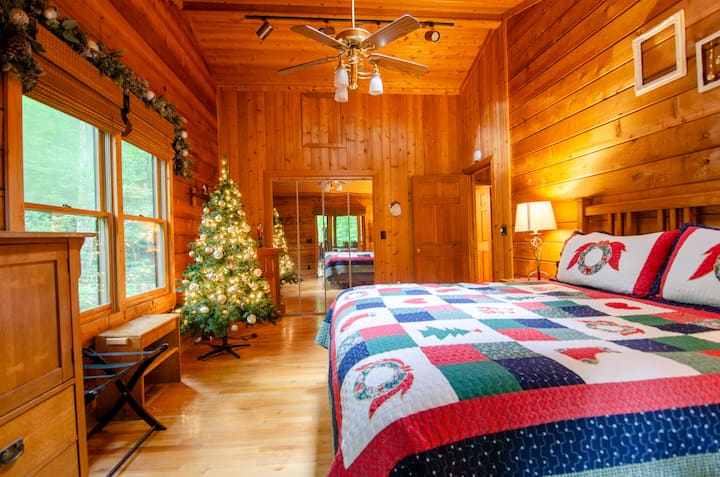 Upstairs King bedroom with electric fireplace.