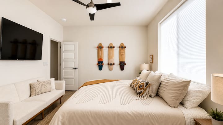 King sized luxury in this fun, skate-themed room.  Two nightstands and closet for storage. Comfy couch to relax, and TV to enjoy your favorite movies.