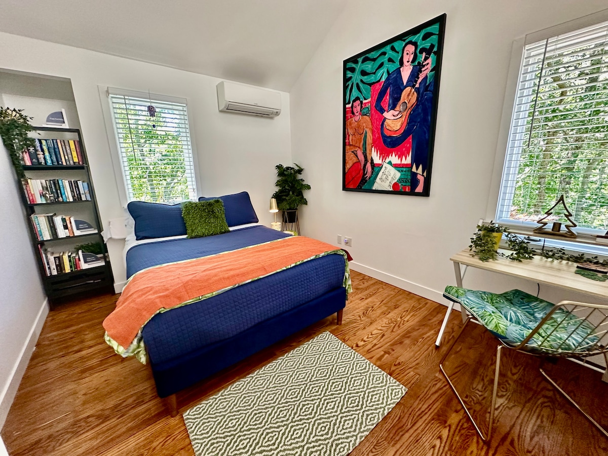 Utopia's  bedroom at Cape Cod Villa: a serene retreat with cozy bedding, unique decor, natural light, a reading nook, ample storage, and enchanting views— Queen bed with twin trundle