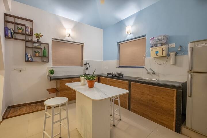 Equipped Kitchen and breakfast bar stool seating.