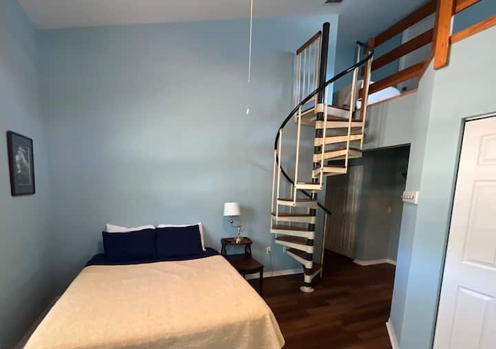Queen bed on ground floor with (2) twin beds in a loft that is accessed by a spiral staircase.  Room includes: private full bath; screened porch; 