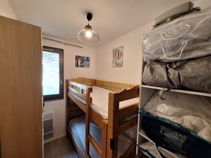 A cozy corner for children: comfortable bunk beds, window for natural light, large storage cabinet for all family belongings. Convenient and soothing after a busy day.