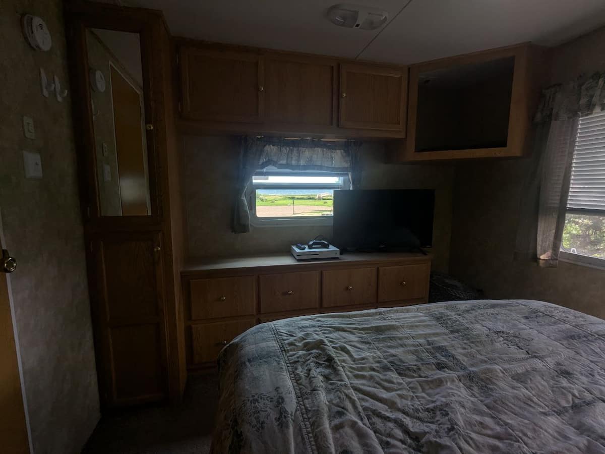 Bedroom with TV and plenty of storage
