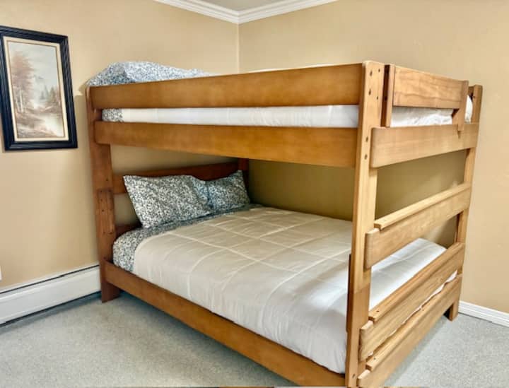Second bedroom has brand new queen mattresses. The bunk bed is a queen over a queen.