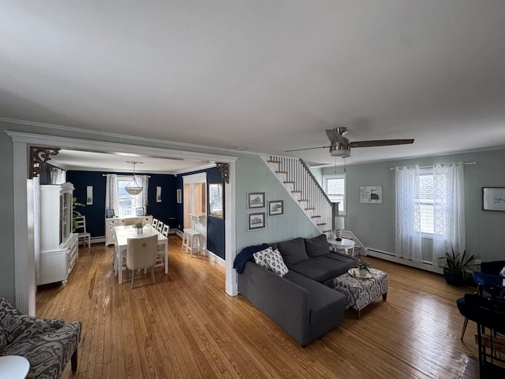 This is one of 3 living rooms in the home. It is bright and airy and opens to a large dining room. 