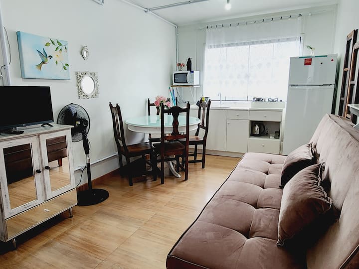 Living room with sofa bed and smart TV