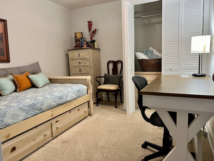 Flex room: multi-purpose room offering a twin daybed and trundle, a private, relaxing reading area, and a desk with built-in outlets and ports.