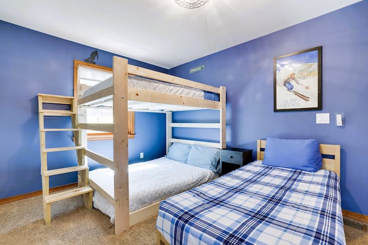 Cozy ski-themed bunk room with super solid Full over Full bunk beds and a twin bed,celing fan, closet bureau