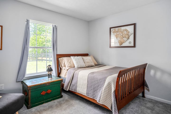 Bedroom 3 - Full size comfy bed with plush carpet, dresser, closet, and a nice view of the backyard.