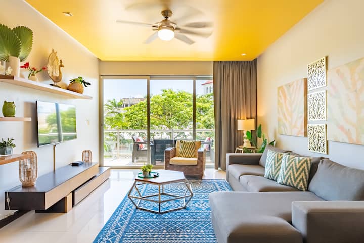 Relax in the living room, perfect for families and guests to chill. Wall to wall sliding doors provide stunning views.
