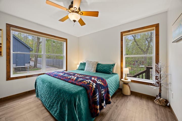 The main floor second bedroom features  private king bed space with ample closet storage. 