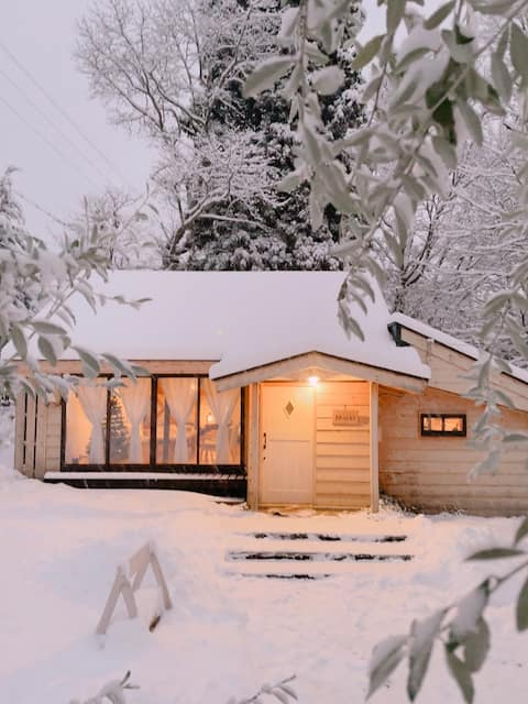 Limited to one group per day, Mökki is a small cottage with a garden by a stream