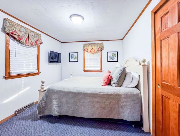 Queen bed with  tv