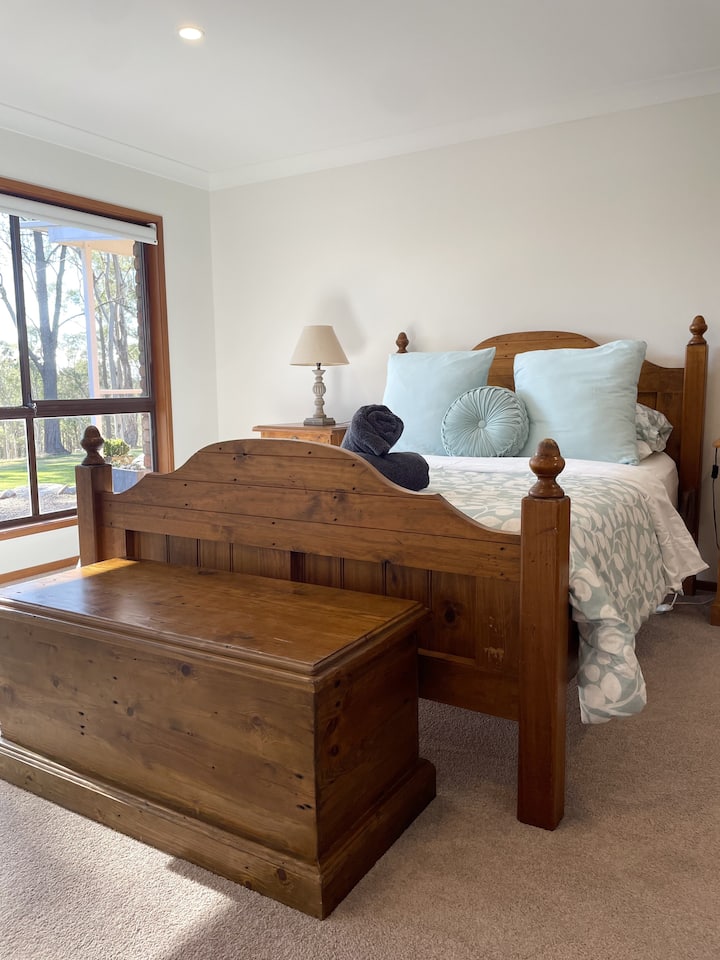 Queen size bed. This room also includes a king size daybed, as well as having a walk in robe and attached ensuite (bathroom 2). There is also access to the outdoor entertaining space.