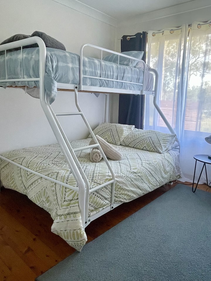 Bunk Bed with single bed at the top and double bed on the bottom.