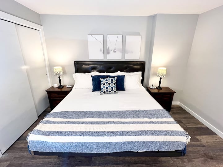 Bedroom 1: On the first floor with king bed and sectional couch.