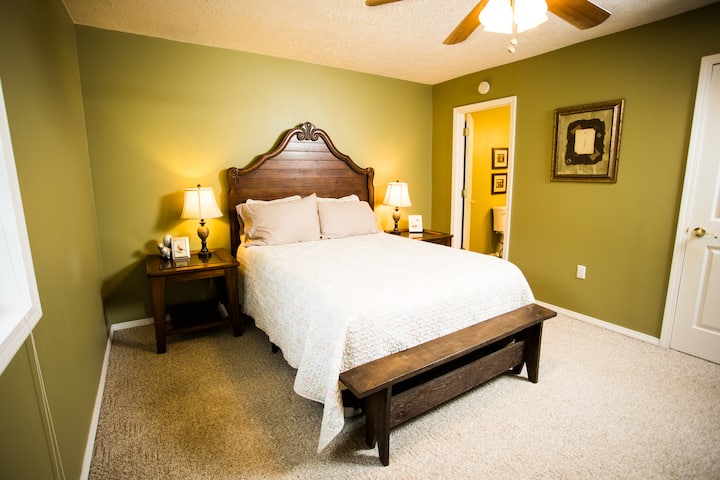 The master bedroom has a queen-size bed and an ensuite bathroom.