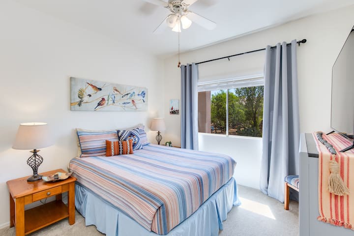 Bright and inviting Bedroom with cozy decor and a peaceful view, perfect for a restful stay.