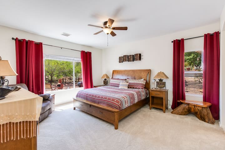 Cozy and spacious master bedroom with a stunning view, perfect for a relaxing stay.