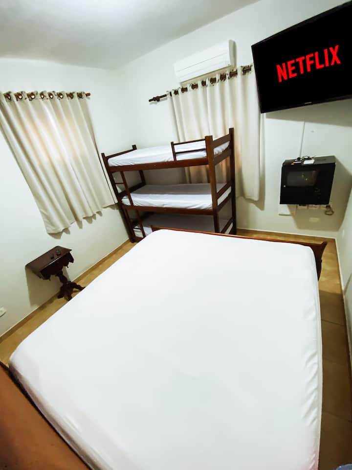 [Main Room] 50" Smart TV, King Size Bed and Wooden Bedside Table