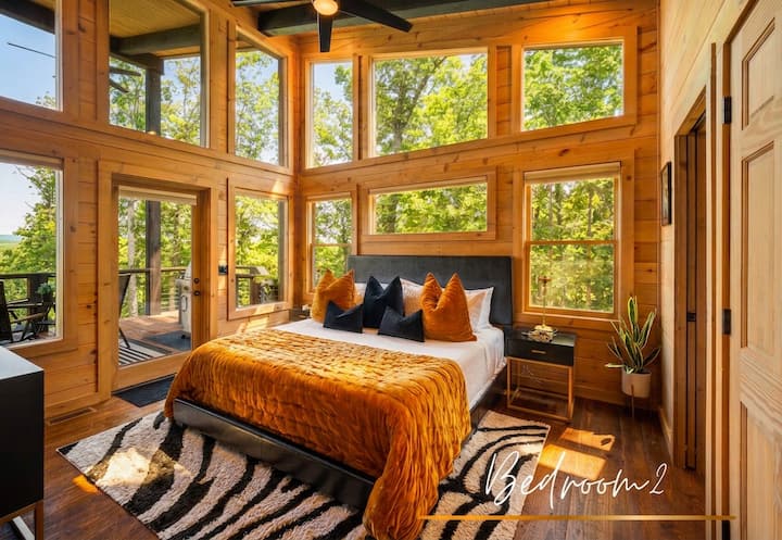The second bedroom offers all the same luxuries as the primary suite. Style and sunbeams in every corner.
