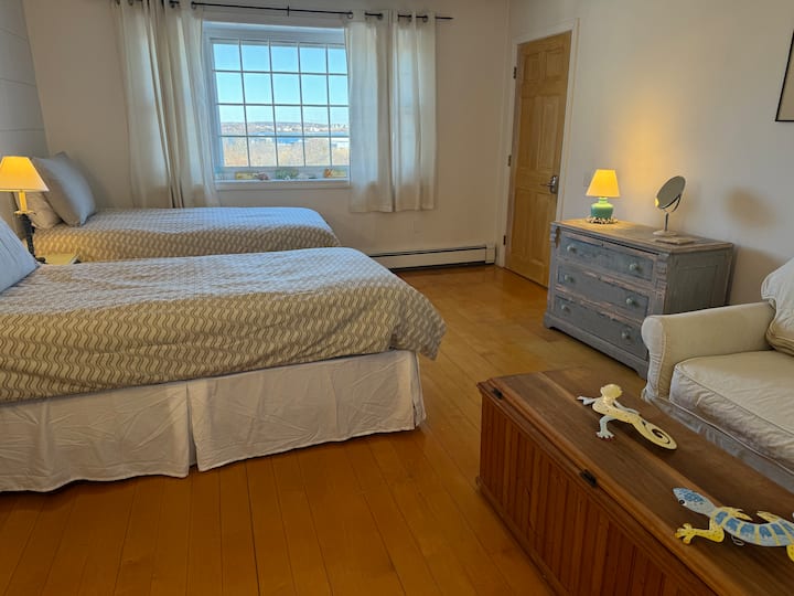 This room is located in the center of the house. It is part of the connected in-law apartment, but it also has a door that leads to the main house. The twin beds can be joined to form a king bed. Advanced notice is required to make the larger bed.
