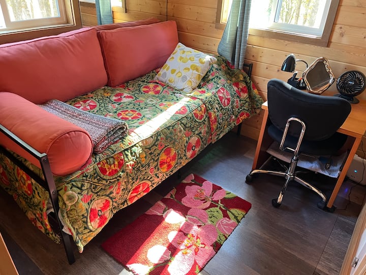 The daybed has a regular twin size mattress.  It is also the sofa from which to watch the wall mounted TV