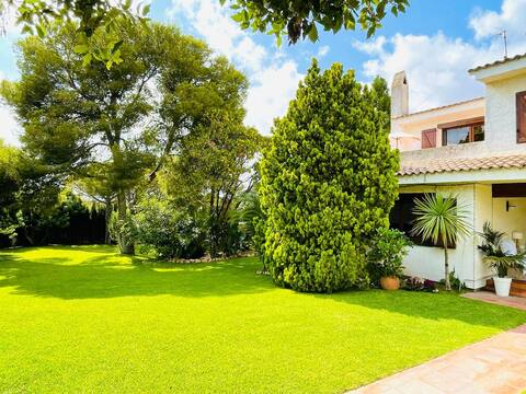 Mediterranean house with large garden and pool.