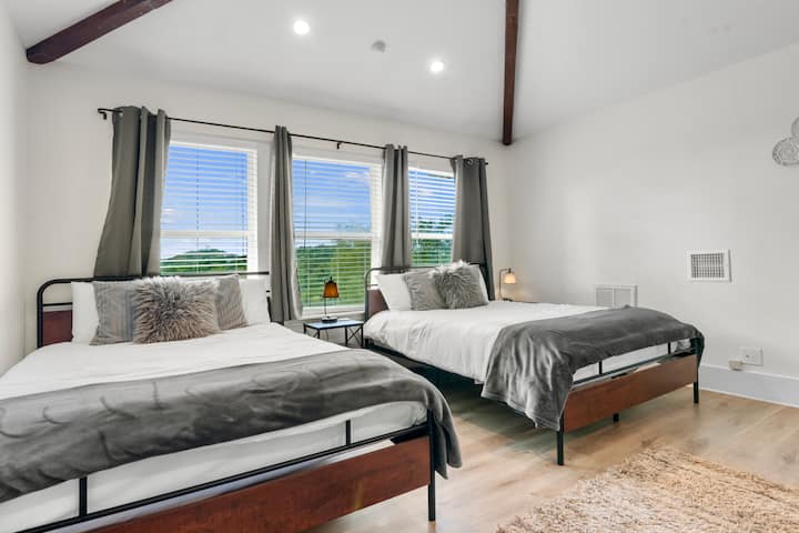 Upstairs bedroom with two queen beds, extra comfortable mattresses, walk in closet and views to boot. 