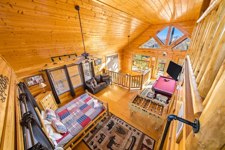 A queen bed, Roku TV, and a variety of games—including a foosball table + pool table + arcade console + several fun board games + Uno cards + Jenga blocks—are all available in the loft area. Boredom doesn’t stand a chance in this cabin !!!