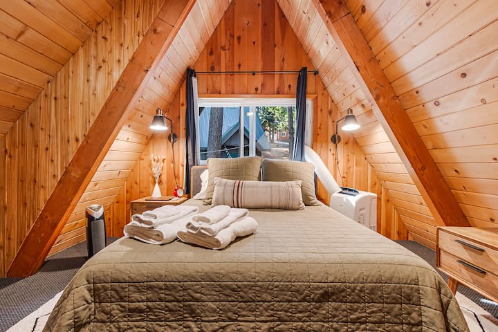 upstairs bedroom has a queen bed (portable AC shown is installed during summer months)