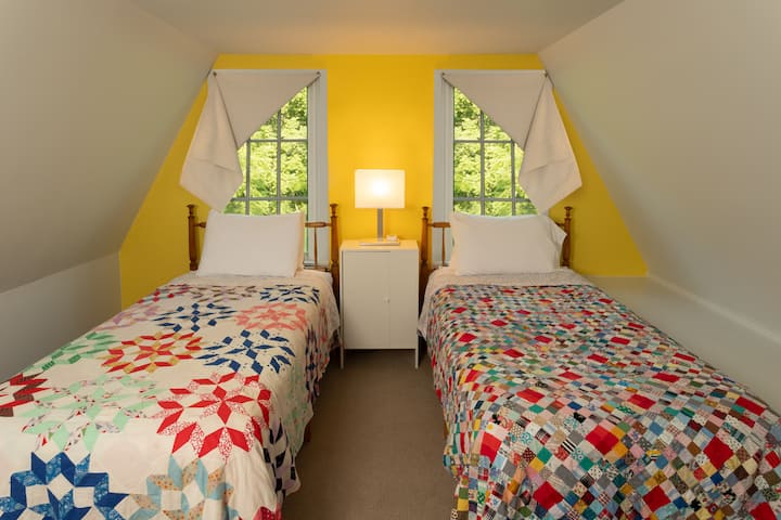 Two extra long twin beds in the summer kitchen loft above the queen bed. Great for kids!