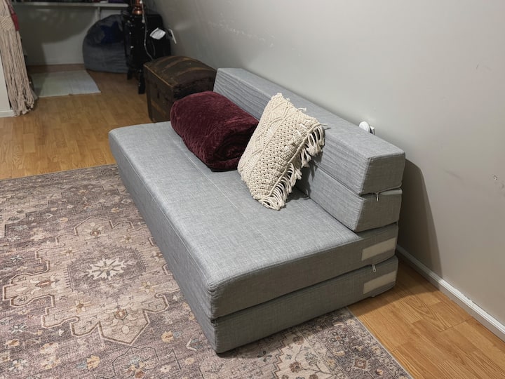 Our third bed is a comfortable, foldable sofa/queen size floor mattress that you can leave upstairs or bring downstairs for more privacy.