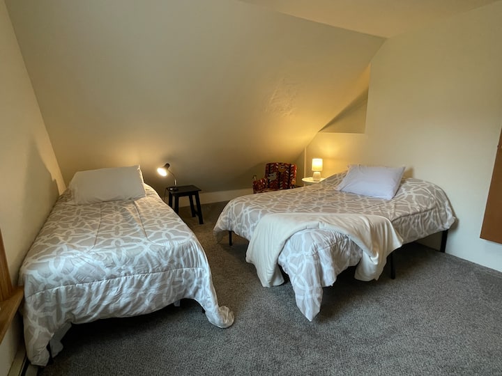 East bedroom has a twin and full/double bed. There is also an inflatable bed in the closet and extra bedding. Closet also holds a pack-n-play crib, if needed.