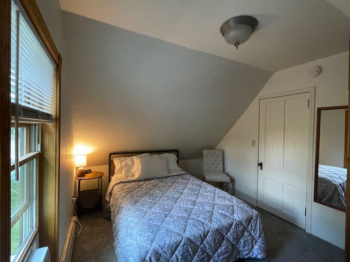 The south bedroom has a full/double bed and built in closet and dresser.